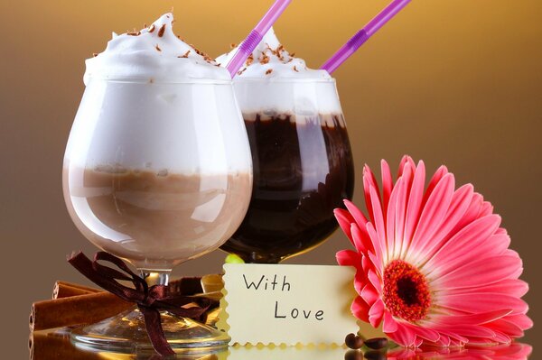 Two chocolate cocktails with strawberries and a romantic note