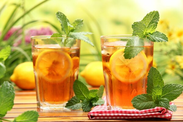 Tea in a glass with lemon and mint