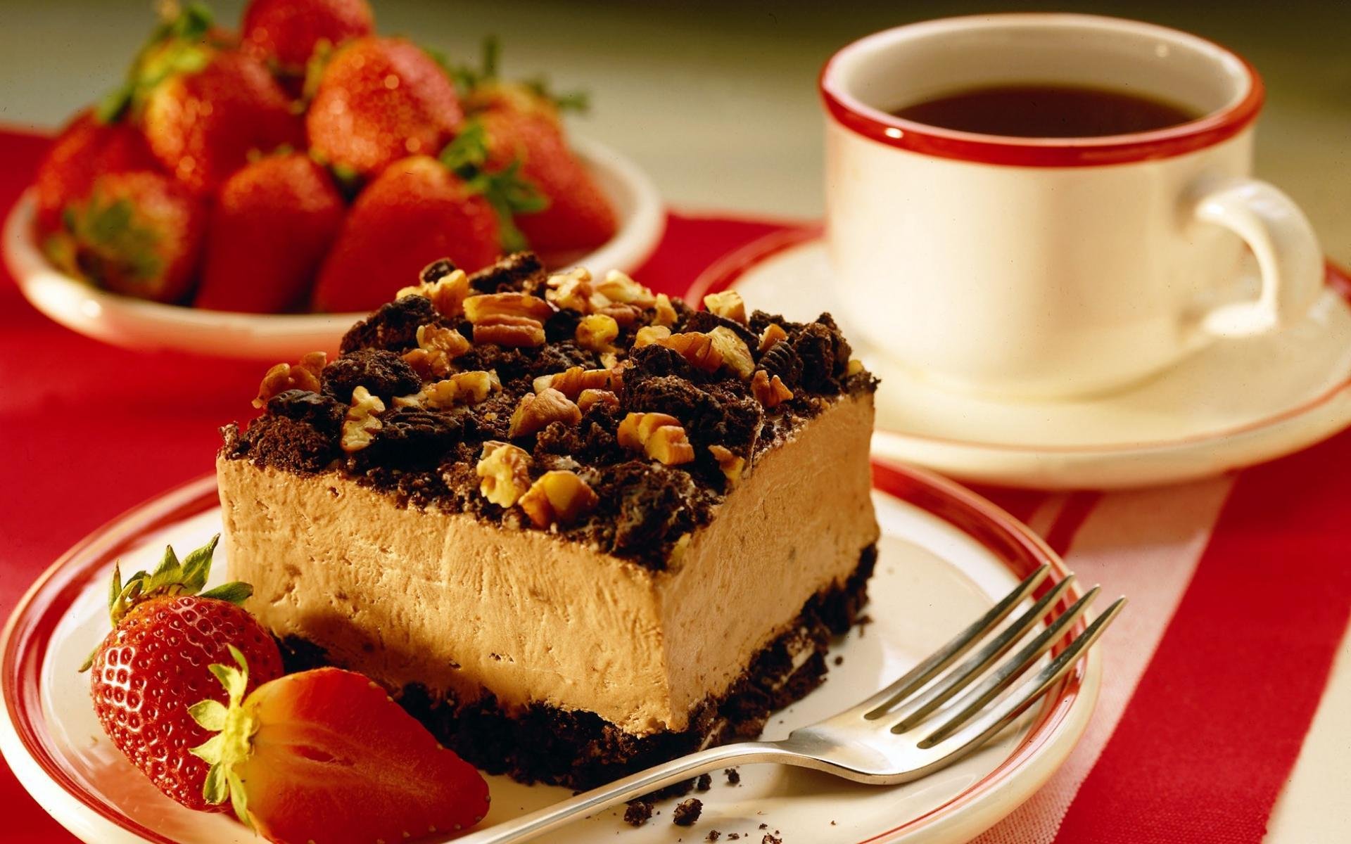 cake with nuts cup mug dish strawberry fork coffee