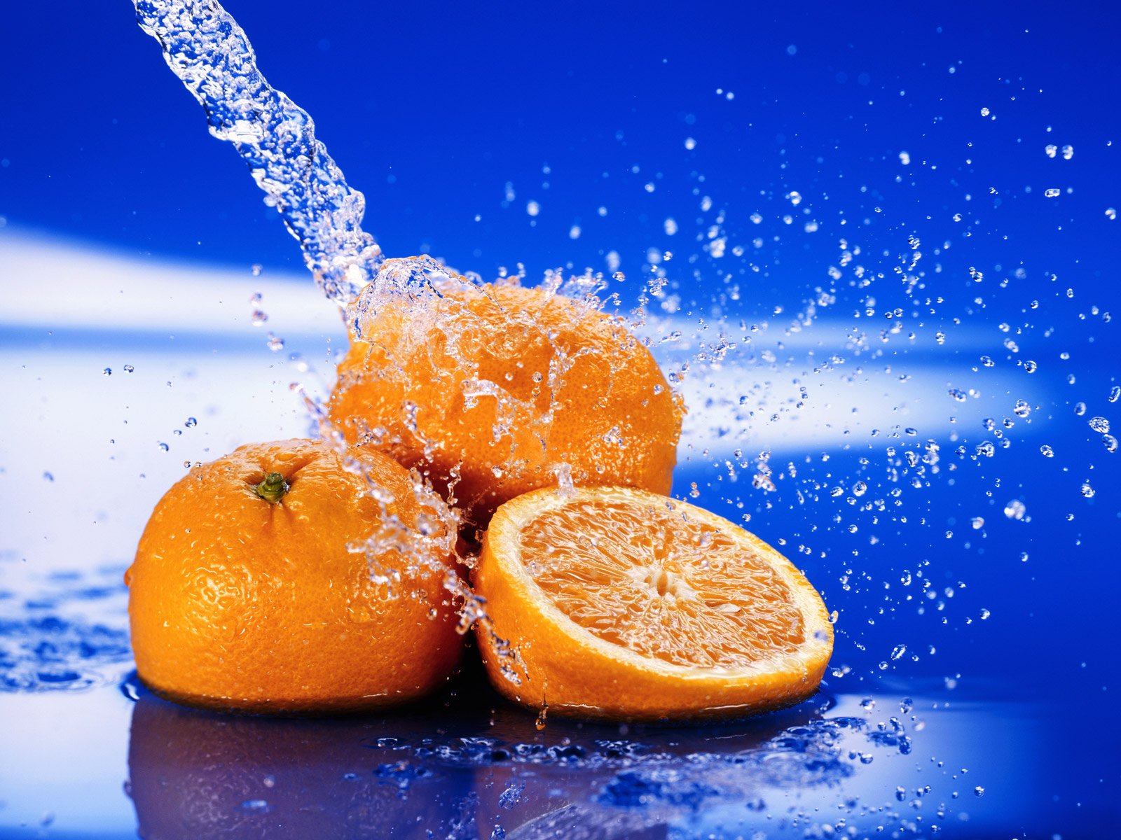 orange water spray drops close up freshness citru