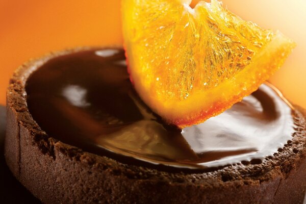 Chocolate tartlet with a slice of orange