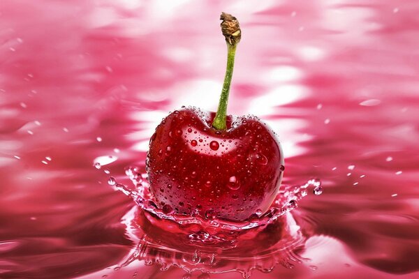 Cherry in a splash of water. Macro shooting