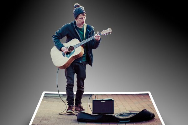 A poor musician on the street with a guitar