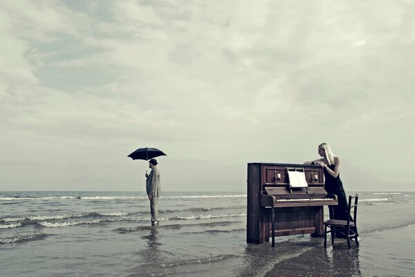 Piano on the beach next to the sea