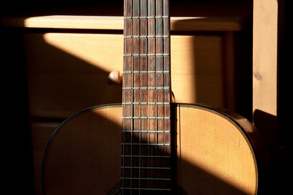 Light and shadow on an acoustic guitar