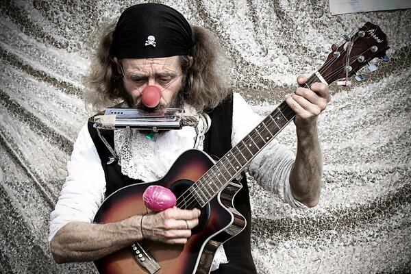 Clown musician with guitar