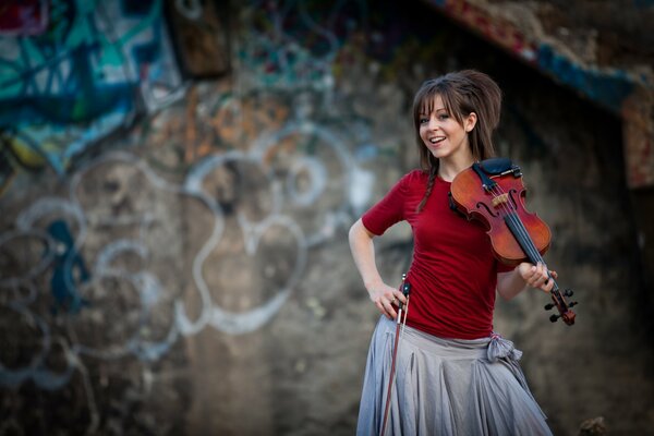 Lindsay Stirling with a violin in her hand