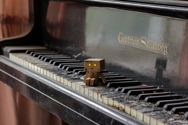 An old piano with a toy on it