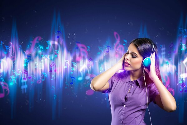 A girl listens to music with headphones on a colored background