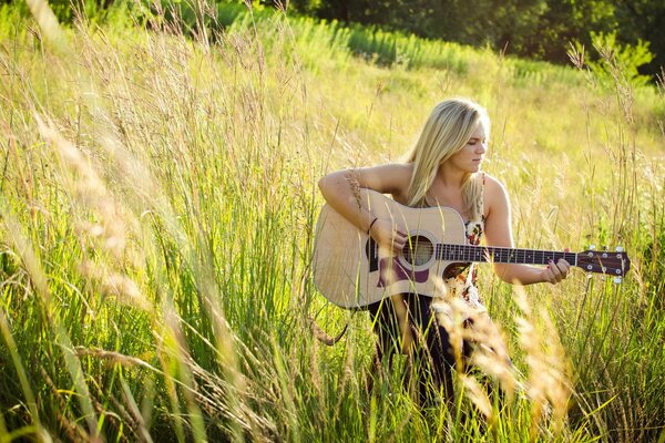 Laura Nicholson plays guitar