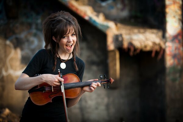 The girl with the violin. Beautiful hairstyle