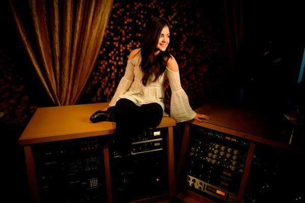 Lucy Hale in the studio recording a song