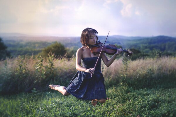 Grass girl playing the violin