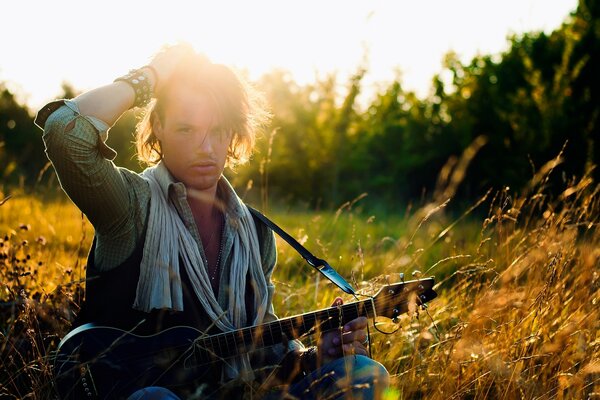 A handsome musician with a guitar