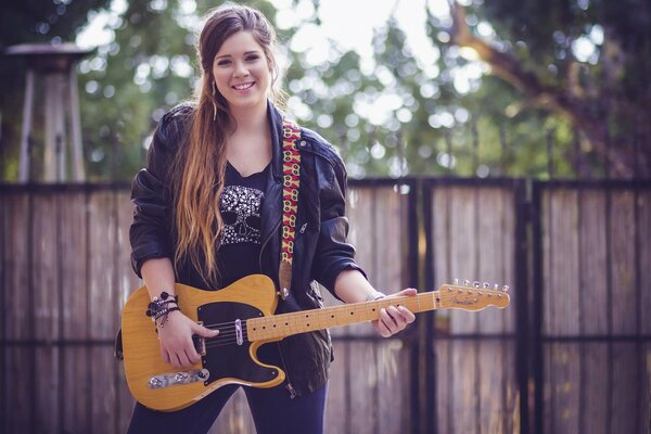 Young girl playing guitar