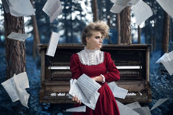 Girl piano notes in the forest