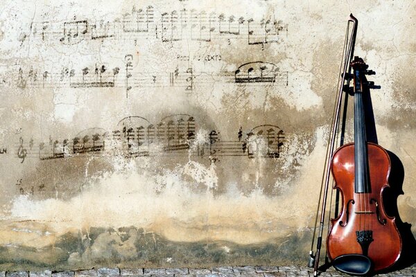 Violin near the wall with notes