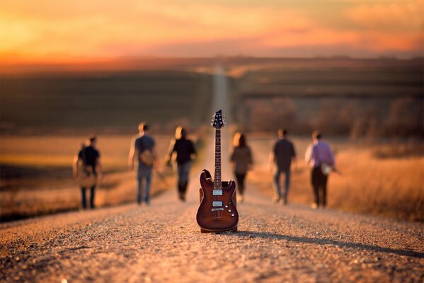 Six musicians walk away from the guitar on the way