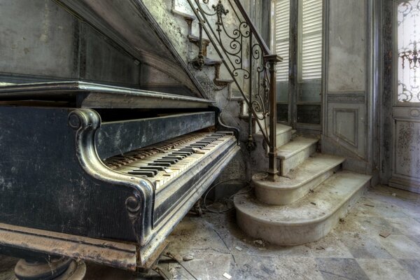 An abandoned old house in which there is an old piano