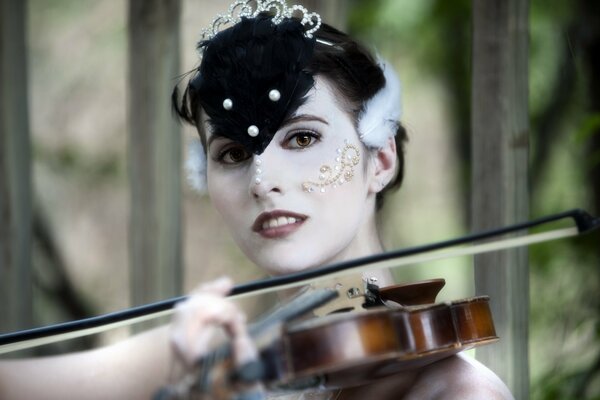 Pale girl with a violin