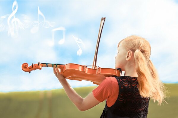 A girl with ponytails plays the violin