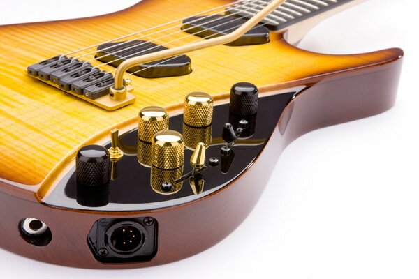 Six-string electric guitar in gold color