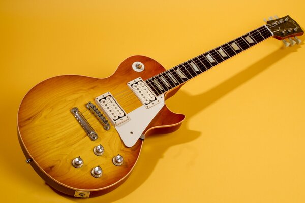 Guitare Gibson 1960 sur fond jaune