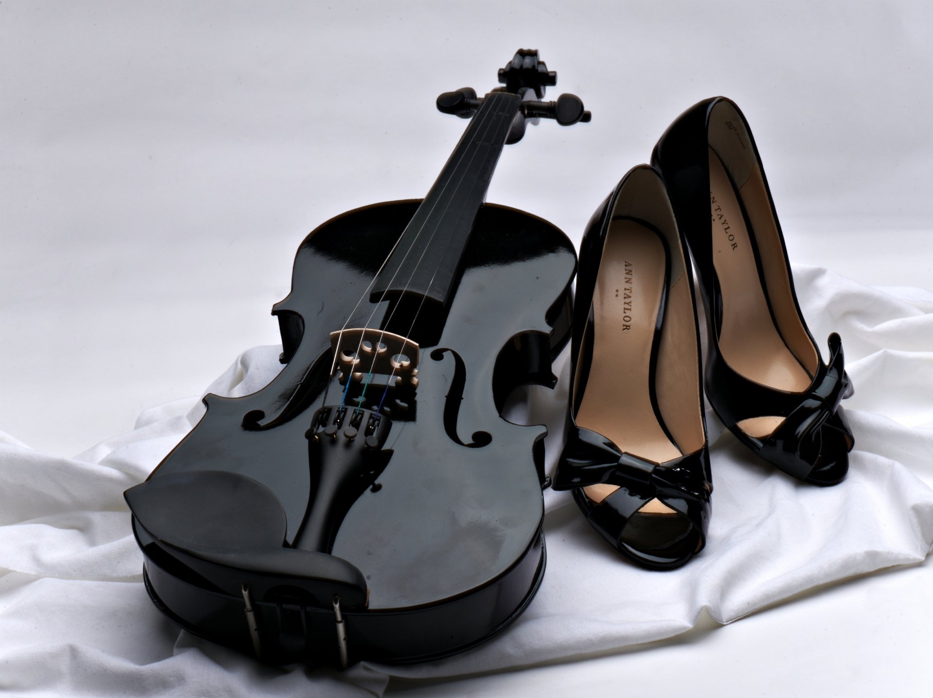 violin black shoes black fabric white background music strings bow