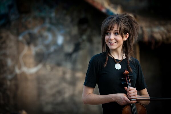 Beautiful girl with a violin in her hands