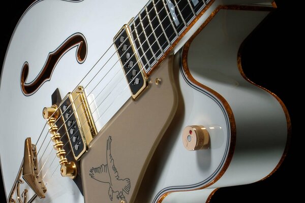 Gorgeous white guitar on a dark background