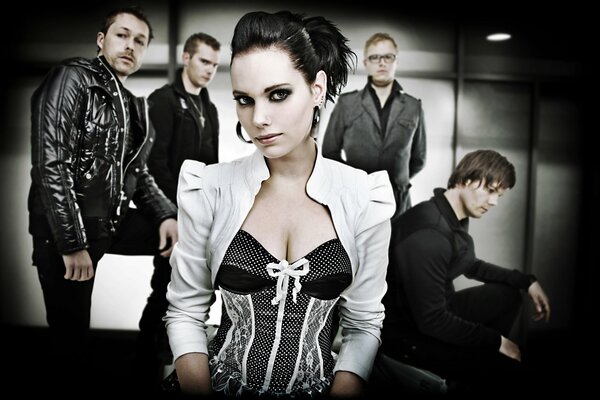 A Gothic singer with her band sings metal