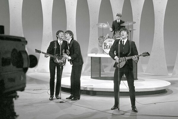 Legendary The beatles sing during a performance