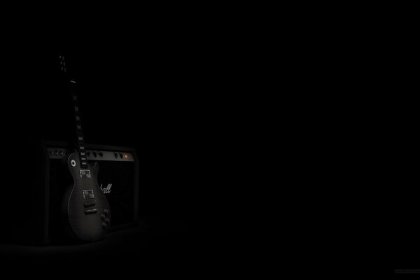 An image of an electric guitar on a darkened stage