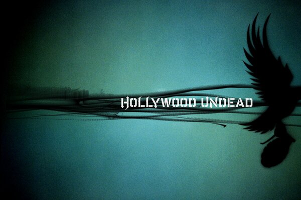 Album der Band hollywood undead: Eine Taube, die eine Granate trägt
