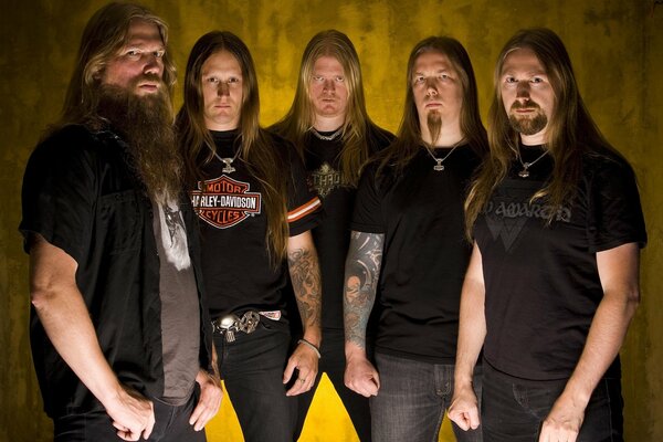 A group of long-haired brutal musicians