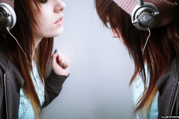 Twin girls listening to music