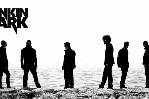 Foto von linkin park am Meer im Sand