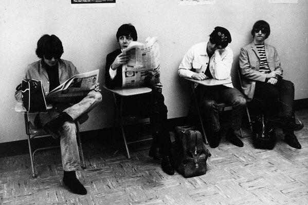 Black and white photo of rock musicians the beatles