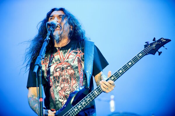 A rock musician at a concert. Electric guitar