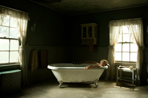 Large bathroom with a girl in the bathtub