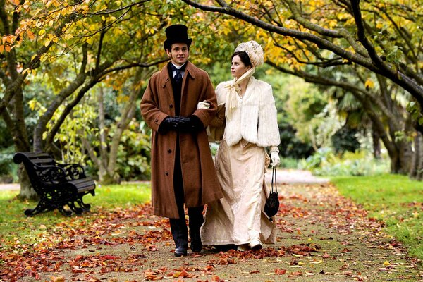 Couple s walk on the alley in the park