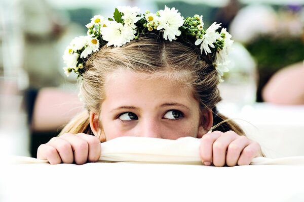 Actress Emma Schweiger with a wreath on her head