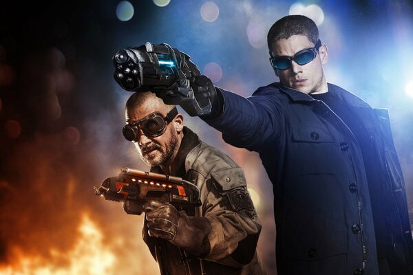 Two guys with guns and glasses