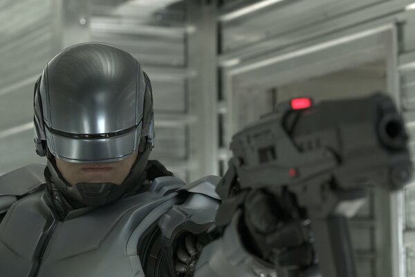 Robocop shoots in helmet close-up