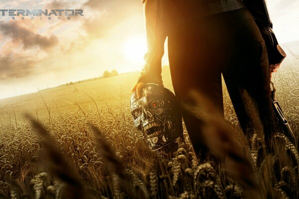 Terminator with a skull in his hand in the field