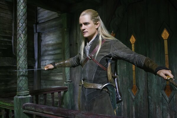 A hobbit with a gun, a man with long blond hair