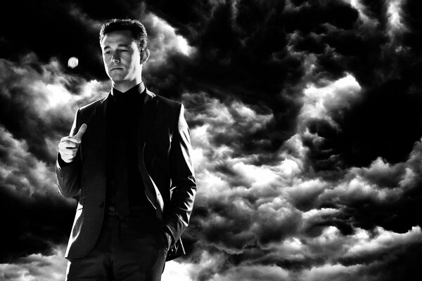 Un hombre con un traje en medio de un cielo tormentoso