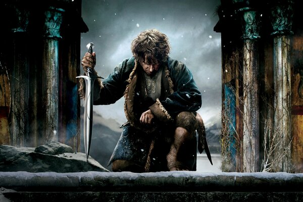 Bilbo the Hobbit with a bent knee and an elven sword