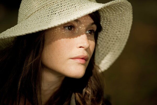 Stylish girl in a white hat