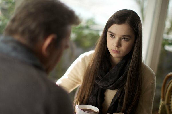 The girl stares at the guy opposite